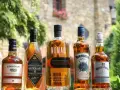 Pięć butelek whisky: Edradour, Antiquary, Nomad, Claymore i Whyte & Mackay. Idealny wybór, by ustalić, ile whisky na wesele potrzebujesz.
